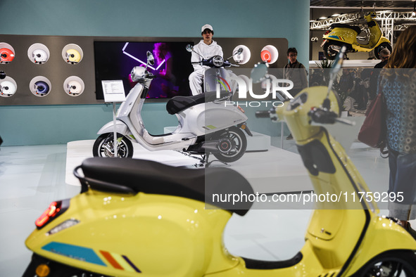 A general view of a motorcycle display at the Vespa Piaggio stand during the 110th edition of EICMA Milan Motorcycle Show at Rho Fiera Milan...