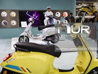 A general view of a motorcycle display at the Vespa Piaggio stand during the 110th edition of EICMA Milan Motorcycle Show at Rho Fiera Milan...