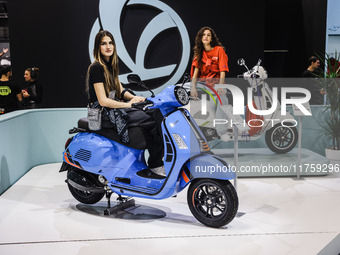 A general view of a motorcycle display at the Vespa Piaggio stand during the 110th edition of EICMA Milan Motorcycle Show at Rho Fiera Milan...