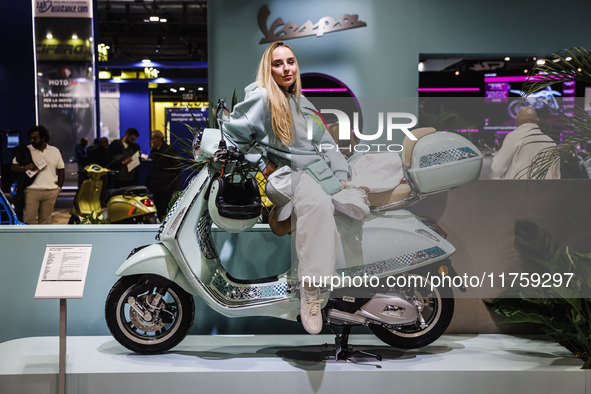 A general view of a motorcycle display at the Vespa Piaggio stand during the 110th edition of EICMA Milan Motorcycle Show at Rho Fiera Milan...