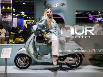 A general view of a motorcycle display at the Vespa Piaggio stand during the 110th edition of EICMA Milan Motorcycle Show at Rho Fiera Milan...