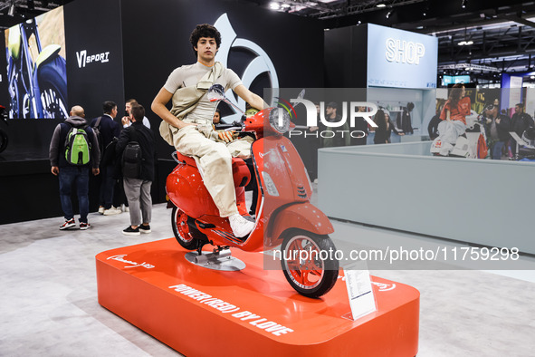 A general view of a motorcycle display at the Vespa Piaggio stand during the 110th edition of EICMA Milan Motorcycle Show at Rho Fiera Milan...