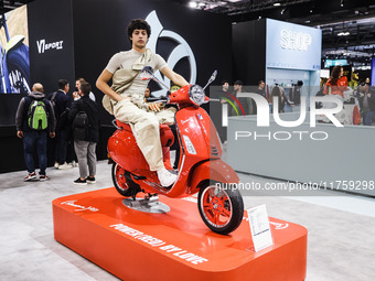 A general view of a motorcycle display at the Vespa Piaggio stand during the 110th edition of EICMA Milan Motorcycle Show at Rho Fiera Milan...