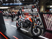 A general view of a motorcycle display at the QJ Motor stand during the 110th edition of EICMA Milan Motorcycle Show at Rho Fiera Milano in...