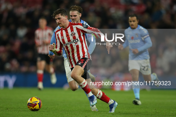 Dennis Cirkin runs with the ball during the Sky Bet Championship match between Sunderland and Coventry City at the Stadium Of Light in Sunde...