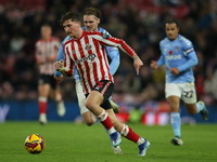 Dennis Cirkin runs with the ball during the Sky Bet Championship match between Sunderland and Coventry City at the Stadium Of Light in Sunde...