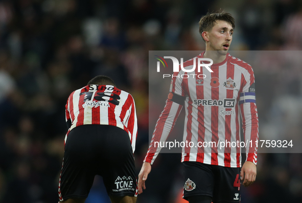 Sunderland's Wilson Isidor (left) and Sunderland's Dan Neil (right) show dejection at full time during the Sky Bet Championship match betwee...