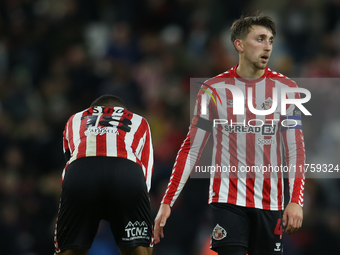 Sunderland's Wilson Isidor (left) and Sunderland's Dan Neil (right) show dejection at full time during the Sky Bet Championship match betwee...