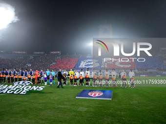 Bologna FC and AS Monaco players line up on the pitch prior the UEFA Champions League 2024/25 League Phase MD4 match between Bologna FC and...