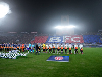 Bologna FC and AS Monaco players line up on the pitch prior the UEFA Champions League 2024/25 League Phase MD4 match between Bologna FC and...