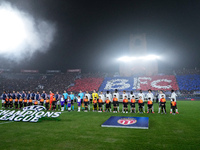 Bologna FC and AS Monaco players line up on the pitch prior the UEFA Champions League 2024/25 League Phase MD4 match between Bologna FC and...