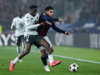 Wilfried Singo of AS Monaco and Santiago Castro of Bologna FC compete for the ball during the UEFA Champions League 2024/25 League Phase MD4...