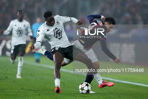 Wilfried Singo of AS Monaco and Santiago Castro of Bologna FC compete for the ball during the UEFA Champions League 2024/25 League Phase MD4...