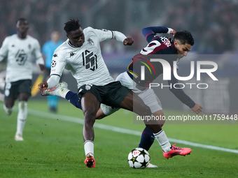 Wilfried Singo of AS Monaco and Santiago Castro of Bologna FC compete for the ball during the UEFA Champions League 2024/25 League Phase MD4...