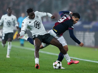 Wilfried Singo of AS Monaco and Santiago Castro of Bologna FC compete for the ball during the UEFA Champions League 2024/25 League Phase MD4...