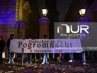 People attend a march commemorating the 65th anniversary of the Night of Broken Glass (Kristallnacht) in  Berlin, Germany on November 9th, 2...