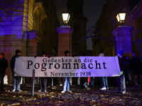 People attend a march commemorating the 65th anniversary of the Night of Broken Glass (Kristallnacht) in  Berlin, Germany on November 9th, 2...