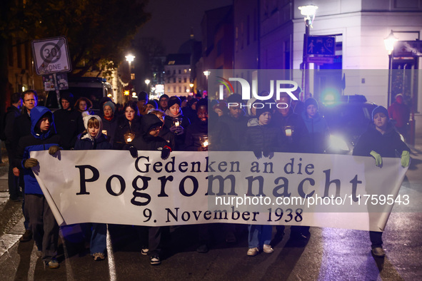 People attend a march commemorating the 65th anniversary of the Night of Broken Glass (Kristallnacht) in  Berlin, Germany on November 9th, 2...