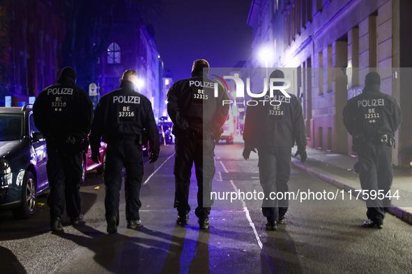 German policemen are protecting a march commemorating the 65th anniversary of the Night of Broken Glass (Kristallnacht) in Berlin, Germany o...