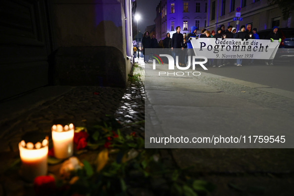 People attend a march commemorating the 65th anniversary of the Night of Broken Glass (Kristallnacht) in  Berlin, Germany on November 9th, 2...