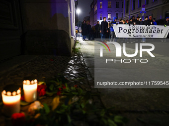 People attend a march commemorating the 65th anniversary of the Night of Broken Glass (Kristallnacht) in  Berlin, Germany on November 9th, 2...