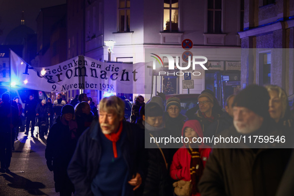 People attend a march commemorating the 65th anniversary of the Night of Broken Glass (Kristallnacht) in  Berlin, Germany on November 9th, 2...