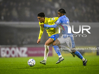 RKC midfielder Daouda Weidmann and NEC forward Sontje Hansen participate in the match between RKC and NEC at the Mandemakers Stadium for the...