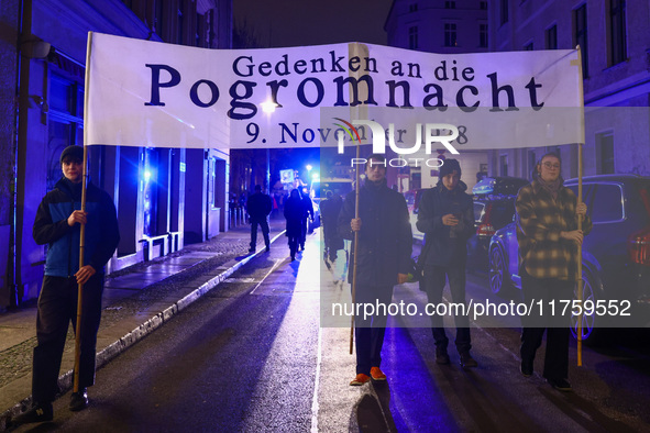 People attend a march commemorating the 65th anniversary of the Night of Broken Glass (Kristallnacht) in  Berlin, Germany on November 9th, 2...