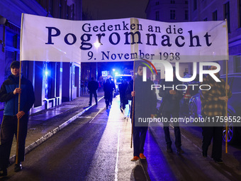 People attend a march commemorating the 65th anniversary of the Night of Broken Glass (Kristallnacht) in  Berlin, Germany on November 9th, 2...