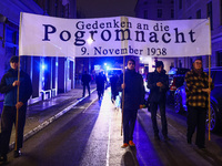 People attend a march commemorating the 65th anniversary of the Night of Broken Glass (Kristallnacht) in  Berlin, Germany on November 9th, 2...