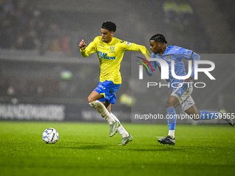 RKC midfielder Daouda Weidmann and NEC forward Sontje Hansen participate in the match between RKC and NEC at the Mandemakers Stadium for the...