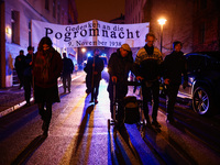 People attend a march commemorating the 65th anniversary of the Night of Broken Glass (Kristallnacht) in  Berlin, Germany on November 9th, 2...