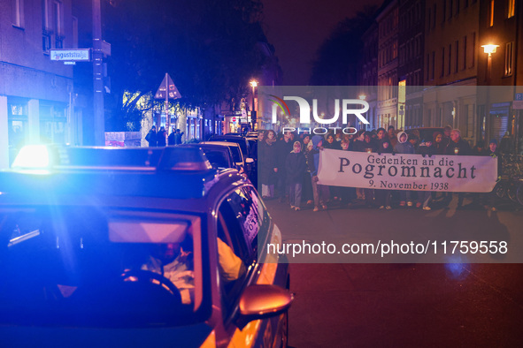 People attend a march commemorating the 65th anniversary of the Night of Broken Glass (Kristallnacht) in  Berlin, Germany on November 9th, 2...