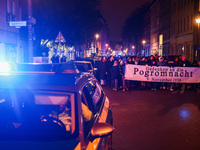 People attend a march commemorating the 65th anniversary of the Night of Broken Glass (Kristallnacht) in  Berlin, Germany on November 9th, 2...