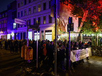 People attend a march commemorating the 65th anniversary of the Night of Broken Glass (Kristallnacht) in  Berlin, Germany on November 9th, 2...