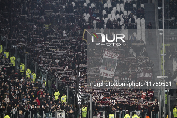 Torino supporters cheer during the Serie A football match number 12, Juventus versus Torino, at the Allianz Stadium in Turin, Piedmont, Ital...