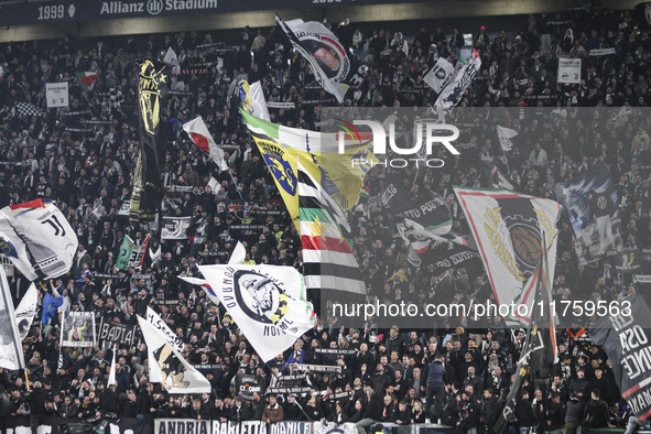 Juventus supporters cheer during the Serie A football match number 12, Juventus vs. Torino, at the Allianz Stadium in Turin, Italy, on Octob...