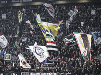 Juventus supporters cheer during the Serie A football match number 12, Juventus vs. Torino, at the Allianz Stadium in Turin, Italy, on Octob...