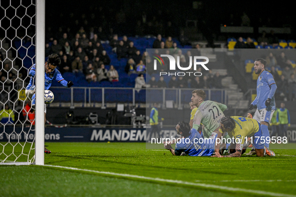 NEC midfielder Kosai Sano and NEC goalkeeper Robin Roefs participate in the match RKC - NEC at the Mandemakers Stadium for the 2024-2025 sea...