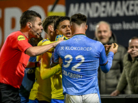 Referee Erwin Blank, RKC midfielder Daouda Weidmann, and NEC forward Vito van Crooij are present during the match between RKC and NEC at the...