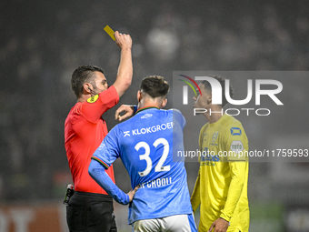 Referee Erwin Blank shows a yellow card to NEC forward Vito van Crooij and RKC midfielder Daouda Weidmann during the match between RKC and N...