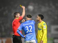 Referee Erwin Blank shows a yellow card to NEC forward Vito van Crooij and RKC midfielder Daouda Weidmann during the match between RKC and N...