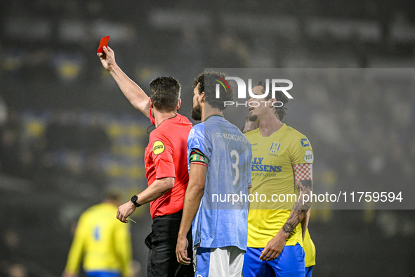 Referee Erwin Blank shows a red card to RKC midfielder Daouda Weidmann during the match between RKC and NEC at the Mandemakers Stadium in Wa...