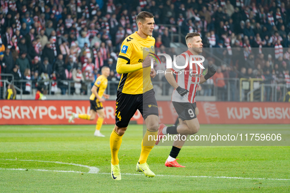 Arkadiusz Jedrych and Benjamin Kallman participate in the game between KS Cracovia and GKS Katowice in Krakow, Poland, on November 9, 2024....