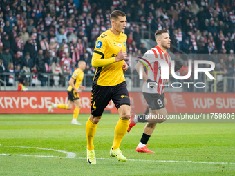 Arkadiusz Jedrych and Benjamin Kallman participate in the game between KS Cracovia and GKS Katowice in Krakow, Poland, on November 9, 2024....