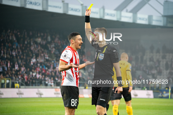 Referee Damian Sylwestrzak shows a yellow card to Patryk Sokolowski during the game between KS Cracovia and GKS Katowice in Krakow, Poland,...