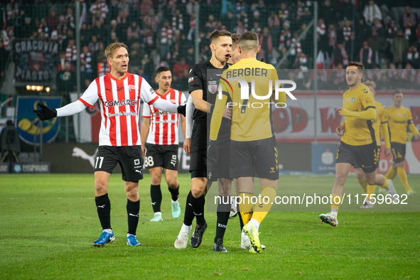 Players argue with referee Damian Sylwestrzak during the game between KS Cracovia and GKS Katowice in Krakow, Poland, on November 9, 2024. P...