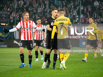 Players argue with referee Damian Sylwestrzak during the game between KS Cracovia and GKS Katowice in Krakow, Poland, on November 9, 2024. P...