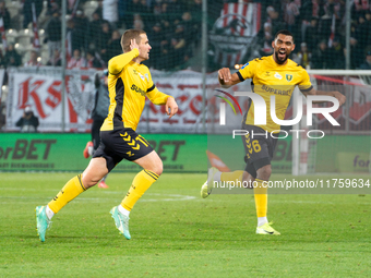 GKS Katowice players Adrian Blad and Lukas Klemenz celebrate scoring a goal during the game between KS Cracovia and GKS Katowice in Krakow,...