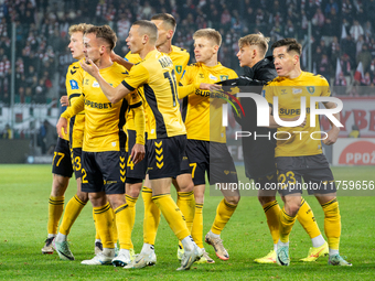 GKS Katowice players celebrate scoring a goal during the game between KS Cracovia and GKS Katowice in Krakow, Poland, on November 9, 2024. T...